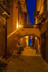 Fototapeta na wymiar Night scene in the old town of Imperia, Italy