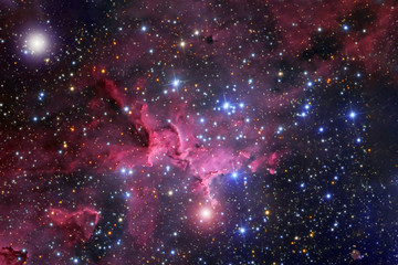 A beautiful nebula of different colors, with stars and galaxies. Elements of this image were...