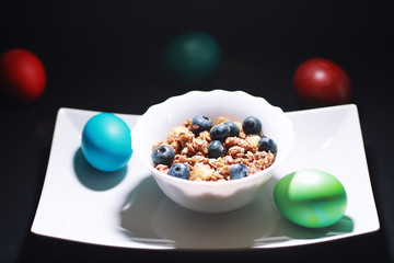 A healthy breakfast cereal with milk and fruit. Oat and corn flakes with chocolate and yogurt. The concept of healthy and vegetarian food.