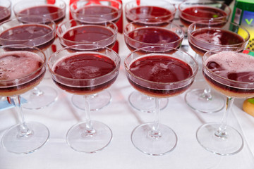 Glasses of a New York sour cocktail standing on the bar counter