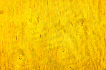 Vibrant yellow wood texture. The texture of the old dried plywood. Background of sunny wood color for design.