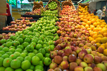Naklejka na ściany i meble Fresh healthy fruits on shelves in supermarket