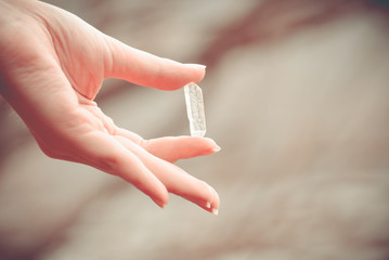 Crystal in the hand. Quartz crystal. Zen Harmony.
