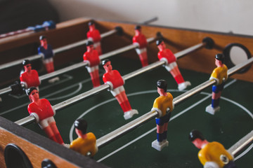 Table with players for playing table football