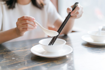  pouring hot water on the chopsticks