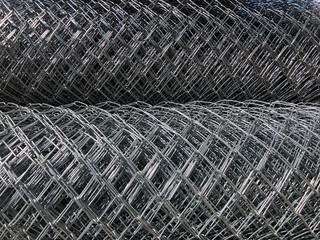 Rolled chain-link fence. Metal mesh netting rolled into rolls