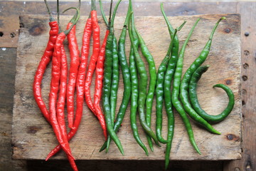 red hot chili peppers on wooden background