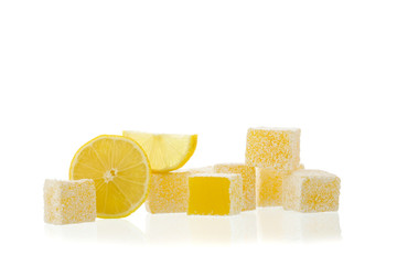 Turkish delight with lemon isolated on white background with reflection.