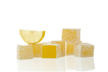 Fruit Turkish delight with lemon slice isolated on white background