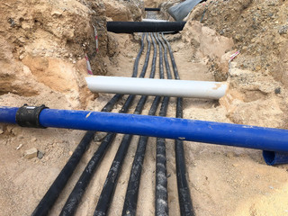 The high voltage electrical cable is laid in a trench