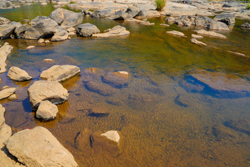 Fototapeta na wymiar water flow between river stone. beautiful natural view 