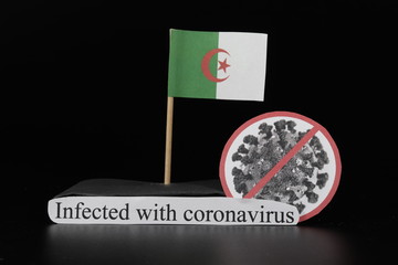 Algeria is infected with covid-19, Severe acute respiratory syndrome coronavirus. Flag of Thailand on wooden stick and cell of disease. Epidemic of coronavirus disease 2019 across world