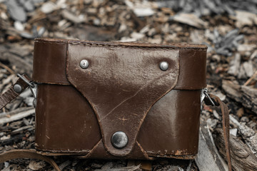 Ancient Retro film camera in the holster