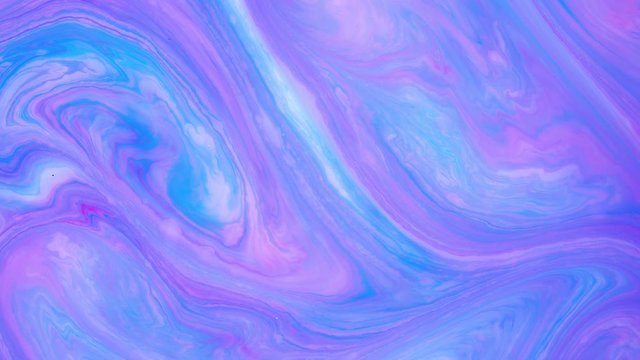Abstract paint ink in motion. Psychedelic ebru background footage. Flowing colorful spots.