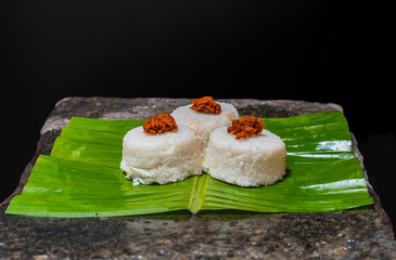 The milk rice on a banana leaf. Milk rice is a traditional Sri Lankan food made from rice and coconut milk which is used to be a main food on any cultural ceremony or occasion