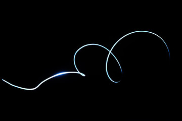Abstract glowing line isolated in black background.