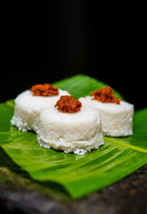 The milk rice on a banana leaf. Milk rice is a traditional Sri Lankan food made from rice and coconut milk which is used to be a main food on any cultural ceremony or occasion