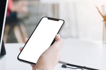 woman using Smartphone. Blank screen mobile phone for graphic display montage.networking service..