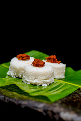 The milk rice on a banana leaf. Milk rice is a traditional Sri Lankan food made from rice and coconut milk which is used to be a main food on any cultural ceremony or occasion
