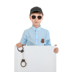 Cute little police officer with blank poster on white background