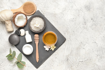Composition with spa items and honey on light background