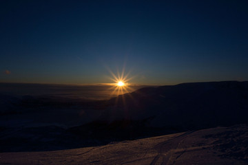 the sun setting over the horizon