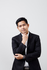 Portrait of young man in suit isolated on white