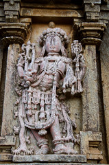 Fototapeta na wymiar Carved idols on the outer wall of Shantinatha Basadi, near Shravanabelagola, Karnataka, India