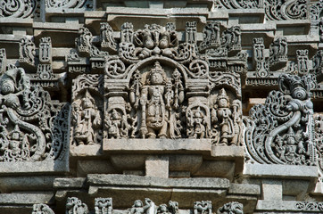 Carved idols on the outer wall of Veera Narayana temple, Belavadi, Karnataka, India