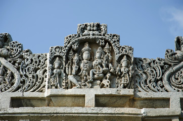 Carved idols on the outer wall of Veera Narayana temple, Belavadi, Karnataka, India