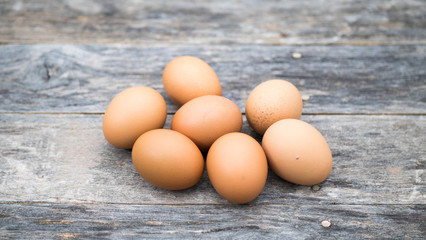 Eggs placed on a wooden table