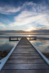 Fototapeta na wymiar Belmont Jetty Sunset - Newcastle NSW Australia. Lake Macquarie south of Newcastle is a popular destination.