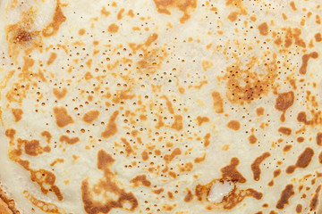 Fried pancakes. The texture of the dough. A treat on Shrove Tuesday. Culinary product.