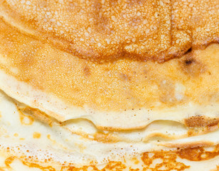 Fried pancakes. The texture of the dough. A treat on Shrove Tuesday. Culinary product.