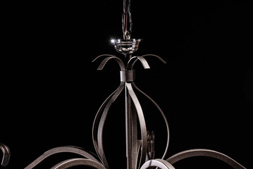 Modern lamp, chandelier on a black background. Lighting element of the interior. environmental materials of lamps