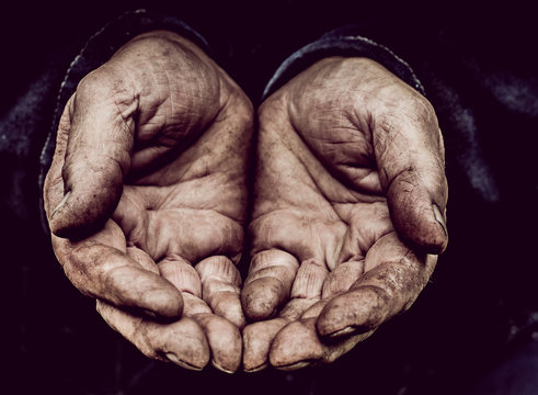 Male worker. His working hands are photographed in close-up.