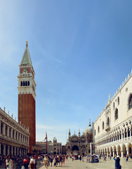 Obraz premium The architectural ensemble of St. Mark's Square with the Campanile (Campanile di San Marco) and the Cathedral (St Mark's Basilica). Venice. Italy.