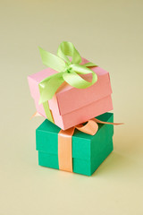 Multicolored gift boxes with ribbon on a light background