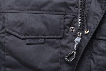 Closeup of black zipper on a wintry black jacket.Zipper winter jacket, close-up.