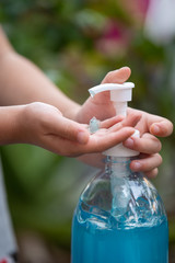 Child Hands Using Wash Hand Sanitizer Gel Pump Dispenser, Selected Focus