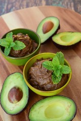 Vegan avocado chocolate mousse with mint leaf