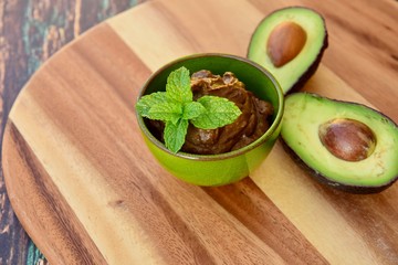 Vegan avocado chocolate mousse with mint leaf