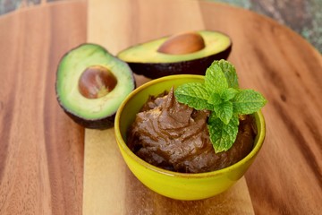 Vegan avocado chocolate mousse with mint leaf