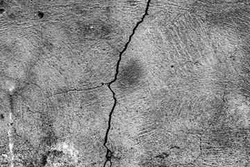 Texture of a concrete wall with cracks and scratches which can be used as a background