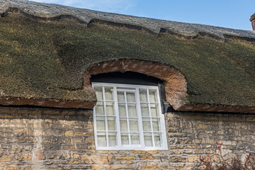 Closeup up of thatched roof on traditional cottage