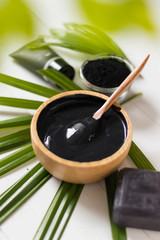 Homemade skin remedies and facial care, activated black charcoal and yogurt mask, cosmetic product