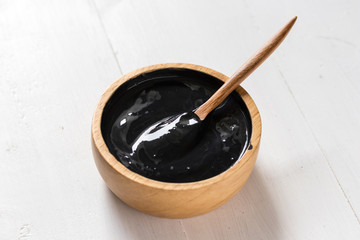 Homemade skin remedies and facial care, activated black charcoal and yogurt mask, cosmetic product