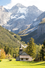 Fototapeta na wymiar Kandersteg valley with green grass and mountain in Switzerland, natural background