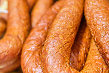 Meat sausages on a store counter.
