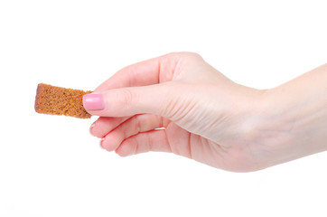 black bread crouton in hand on white background isolation
